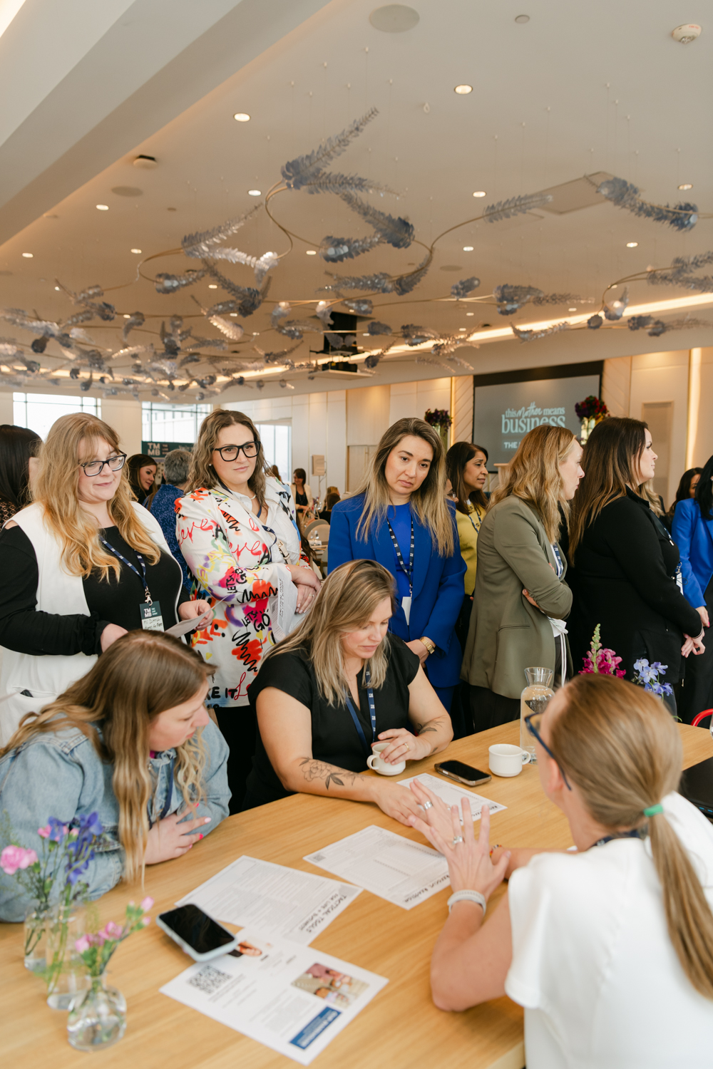Women connecting at a This Mother Means Business event